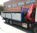 Mounting of a used Fassi crane F260BXP.26 on a new truck